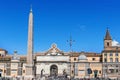 Tourists visiting Piazza Popolo and passing by obelisk Flaminio. in Rome, Italy