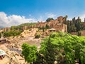 Tourists visiting the roman theatre of Malaga, Spain on a sunny day. Royalty Free Stock Photo