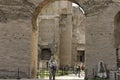 Tourists visiting Rome ruins