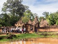 Tourists visiting sandstone temple in Cambodia