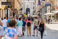 Tourists Visiting And Shopping Famous Brand Stores In Downtown Vienna