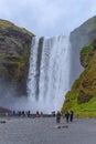 Tourists visiting Skogafoss waterfall
