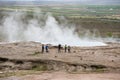 Tourists visiting Strokkur geyser in Iceland Royalty Free Stock Photo