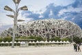 Tourists visiting and taking photos in front of the Beijing National Stadium also called the Bird`s Nest in Bejing, China Royalty Free Stock Photo