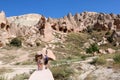 Tourists visiting zelve open air museum, archaeological site in cappadocia