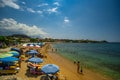 Tourists and visitors enjoy the summer at the sandy beach of Stoupa near Kardamili in Messinia, Greece