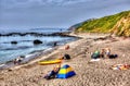 Tourists and visitors Portwrinkle beach Whitsand Bay Cornwall England United Kingdom in colourful HDR Royalty Free Stock Photo