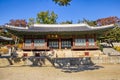 Tourists and visitors take selfie photos in front of an artistic Oriental building of the Changgyonggung Palace