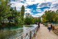 Tourists and visitors walking in the beautiful streets of Annecy town against a cloudy sky. Annecy, Haute Savoie, France Royalty Free Stock Photo