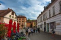 Tourists and visitors walking in the beautiful streets of Annecy town against a cloudy sky. Annecy, Haute Savoie, France Royalty Free Stock Photo