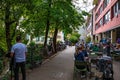 Tourists and visitors walking in the beautiful streets of Annecy town against a cloudy sky. Annecy, Haute Savoie, France Royalty Free Stock Photo