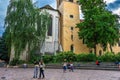 Tourists and visitors walking in the beautiful streets of Annecy town against a cloudy sky. Annecy, Haute Savoie, France Royalty Free Stock Photo