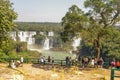 tourists at viwepoint above Iguacu river, at Iguacu falls, Brazil Royalty Free Stock Photo