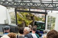 Tourists wait for the famous Mount Floyen funicular to arrive