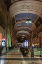 Tourists wait to take the train to the central station of Milan, Italy