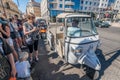 Tourists waiting in line to board a tuk tuk.. Royalty Free Stock Photo