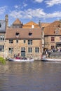 Tourists waiting in port at Rosary Quay for Boat trip for a water channel cruise, Bruges, Belgium Royalty Free Stock Photo