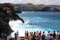 Tourists waiting their turn to take pictures of this spot where the Indic sea waves hit the cliff close to a rocky pool.