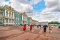 Tourists walk across the large promenade in between Catherine Palace and Gardens in Tsarskoye Selo, Pushkin, Russia Royalty Free Stock Photo