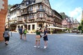 tourists walk along the historical streets, beautiful ancient European German Bacharach city, old half-timbered houses, tourism in Royalty Free Stock Photo