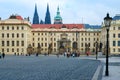 Tourists walk along Hradchanskaya Square. Gate of Titans and Gate of Mathias, Prague Castle, Prague, Czech Republic Royalty Free Stock Photo