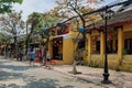 Tourists walk along the street in Ho An old town area.