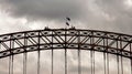 Tourists walk along the upper arch of Sydney Harbor bridge in Australia. Royalty Free Stock Photo