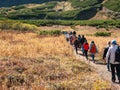 Tourists walk along the Vachkazhets ridge. Kamchatka Peninsula, Russia