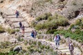 Tourists walk on an ancient inca trail