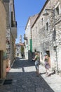 Tourists walk the ancient streets of areopolis in greece on mani Royalty Free Stock Photo