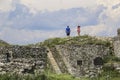 Tourists walk around historic ruins Rozafa Castle in Shkoder, Albania Royalty Free Stock Photo