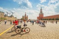 Tourists walk around the main attraction of Moscow and Russia - red Square with views of the Kremlin