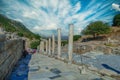 Tourists walk down the Street of Curetes towards the Library of Celsus