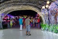 Tourists walk in evening in popular shopping and entertainment complex Soho Square, Sharm El Sheikh, Egypt