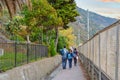 Tourists walk the hiking path to Corniglia, Italy, along the coast of Italy at the Cinque Terre Royalty Free Stock Photo