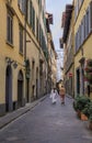 Tourists walk in a medieval street in Centro Storico, Florence, Italy Royalty Free Stock Photo