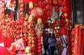 Tourists walk past colorful of decoaration.