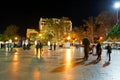 Tourists walk on promenade in Yalta city in night Royalty Free Stock Photo