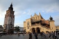 Tourists walk through Rynek Glowny, the main square in the Old Town of Krakow, Poland Royalty Free Stock Photo