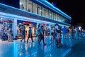 Tourists walk in shopping and entertainment district of Soho Square in evening, Sharm El Sheikh, Egypt