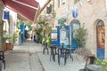 Tourists walk by shops and art galleries in Safed
