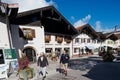 Tourists walk by the street of Mittenwald, Germany.