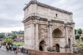 Tourists walk and take pictures in the photo on the tour of the ancient ruins of the ancient imperial capital of the Roman Forum a