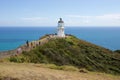 Tourists walk to lighthouse at Cape Reinga, Northland, New Zealand