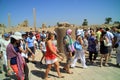 Tourists walk to the scarab beetle for luck