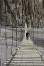 Tourists walking across suspension bridge ,Hunza Valley