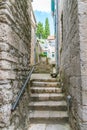 Tourists are walking along the narrow streets of the old city. Royalty Free Stock Photo