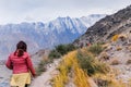 Tourists walking along the track at Passu glacier in autumn season. Royalty Free Stock Photo