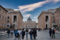 Tourists stroll Via della Conciliazione towards St. Peter& x27;s, Vatican City