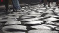 Tourists walking on an ancient roman road at the colosseum in slow motion